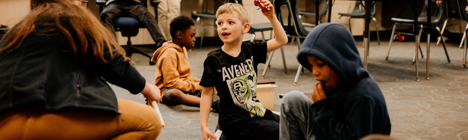 students pictured partaking in music class